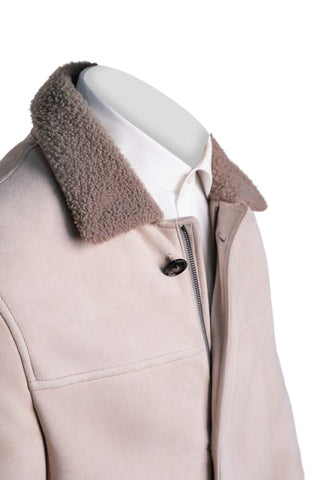 Beige coat with brown shearling collar on a mannequin against a white background