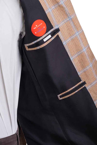 Close-up of a black jacket with a plaid pattern on a white background